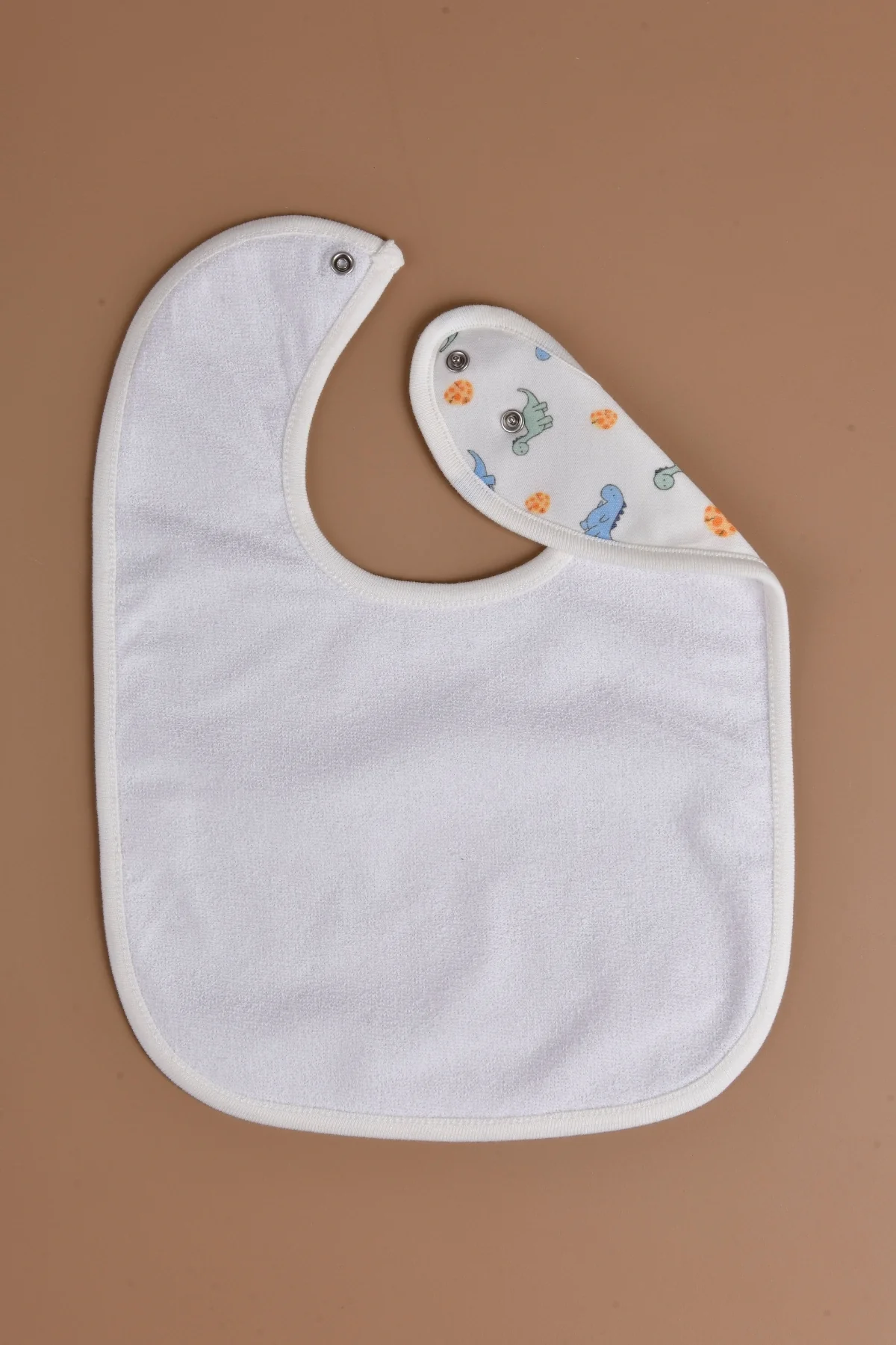 Picture of Sıvı Geçirmez  Mama Önlüğü - Dinazor Desenli